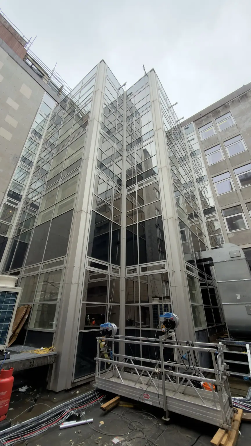 Specialist access equipment inside a multi-storey glazed atrium