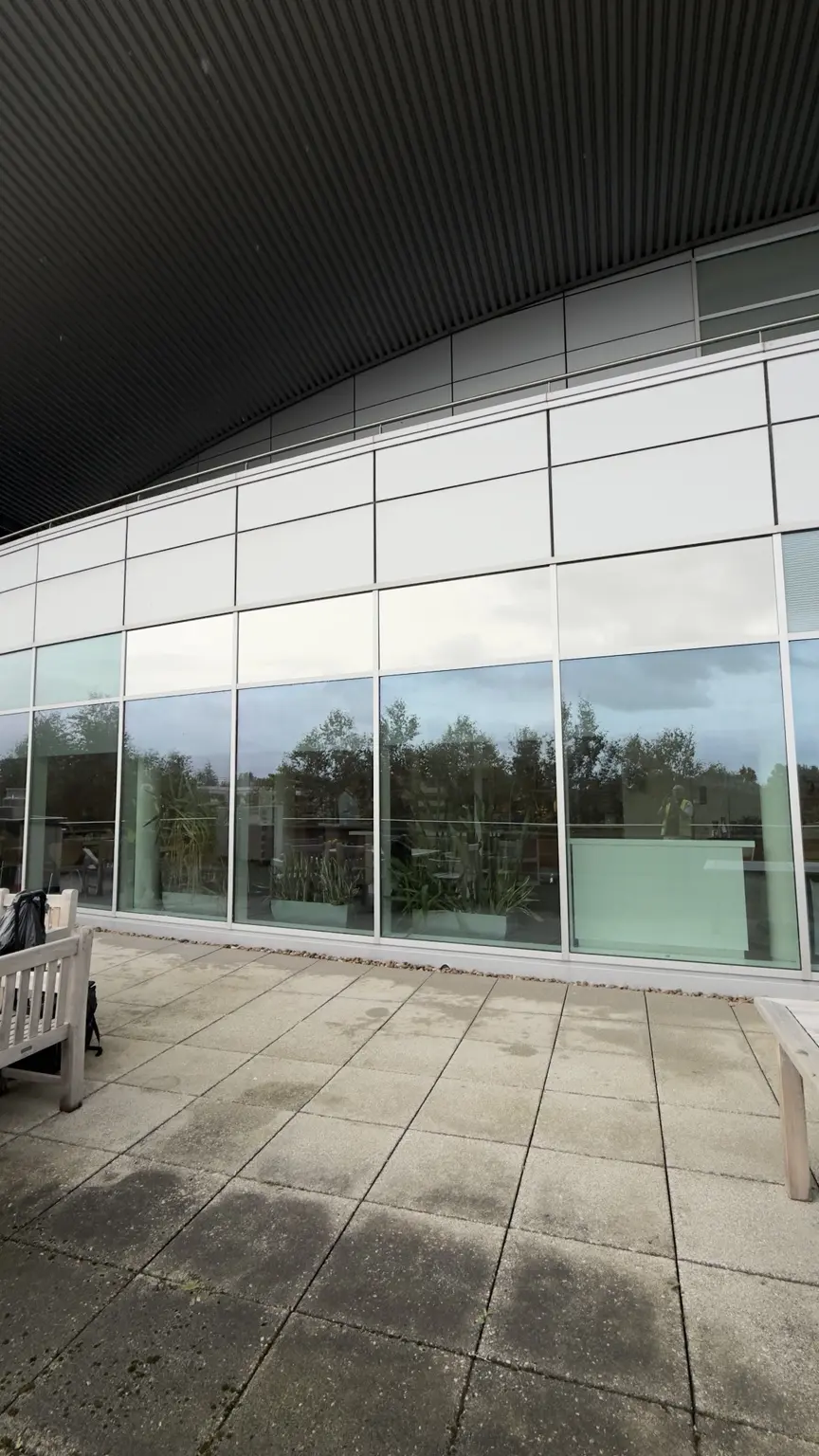 Commercial glazed façade with reflective window film