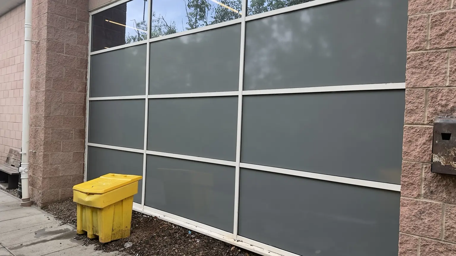 Opaque spandrel finish applied to commercial glazing